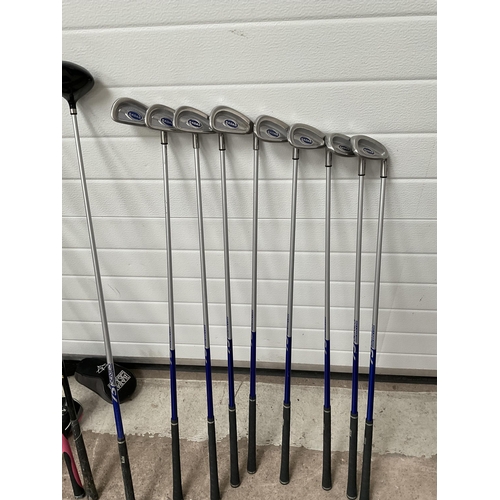 126 - LADIES CARBON FIBRE GOLF CLUBS AND BAG AND A SPARE BAG