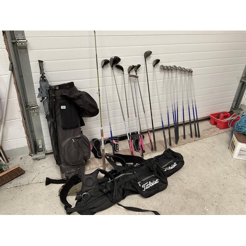 126 - LADIES CARBON FIBRE GOLF CLUBS AND BAG AND A SPARE BAG