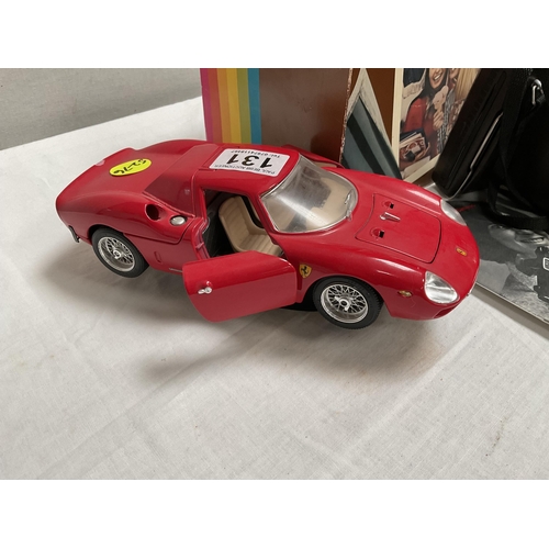 131 - VINTAGE POLAROID CAMERA AND MODEL FERRARI CAR