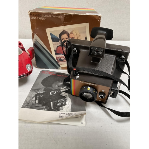 131 - VINTAGE POLAROID CAMERA AND MODEL FERRARI CAR