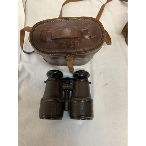 143A - 2 VINTAGE LEATHER CASED FIELD BINOCULARS