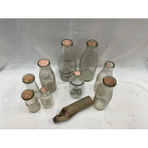 163 - VINTAGE CRATE OF VINTAGE MILK BOTTLES AND TOPS