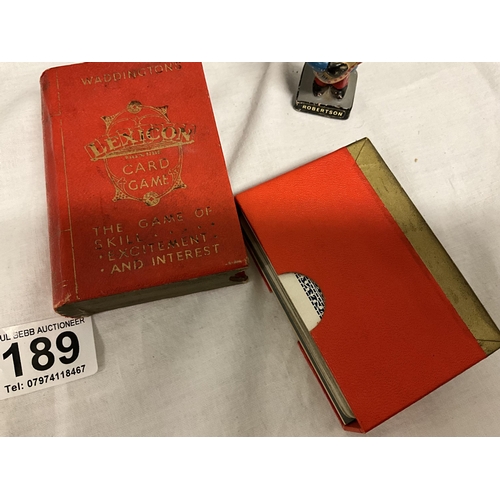 189 - BOX WITH ROBERTSONS GOLLY BAND, SMALL BADGE AND VINTAGE PLAYING CARDS IN A JAMAICA BOX