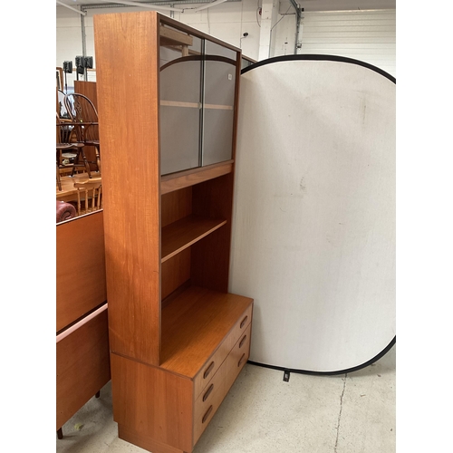 488 - VINTAGE TEAK LOUNGE CABINET WITH SLIDING GLASS DOORS TO TOP OPEN SHELVES OVER 3 DRAWER BASE BADGED G... 