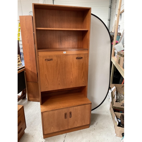 490 - VINTAGE TEAK LOUNGE CABINET WITH OPEN SHELVES OVER COCKTAIL CABINET AND 2 DOORS TO BASE BADGED G PLA... 