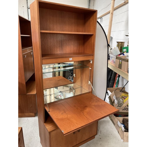 490 - VINTAGE TEAK LOUNGE CABINET WITH OPEN SHELVES OVER COCKTAIL CABINET AND 2 DOORS TO BASE BADGED G PLA... 