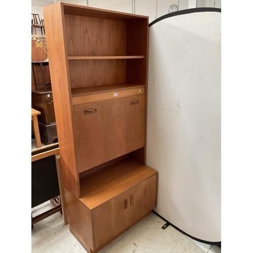 491 - VINTAGE TEAK LOUNGE CABINET WITH OPEN SHELVES OVER COCKTAIL CABINET AND 2 DOORS TO BASE BADGED G PLA... 