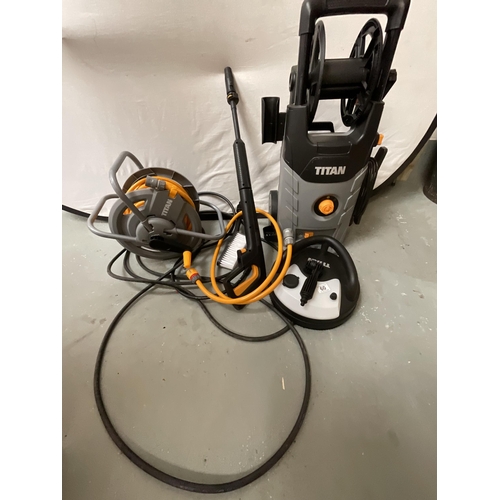 60 - NEW TITAN PRESSURE WASHER WITH FITTINGS AND A HOSE ON REEL