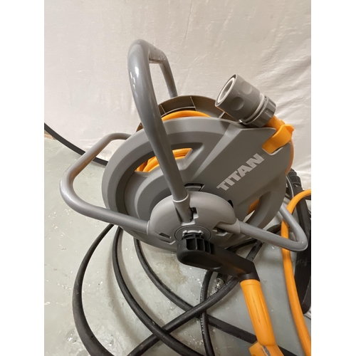 60 - NEW TITAN PRESSURE WASHER WITH FITTINGS AND A HOSE ON REEL