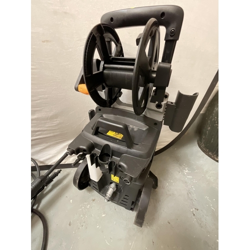 60 - NEW TITAN PRESSURE WASHER WITH FITTINGS AND A HOSE ON REEL