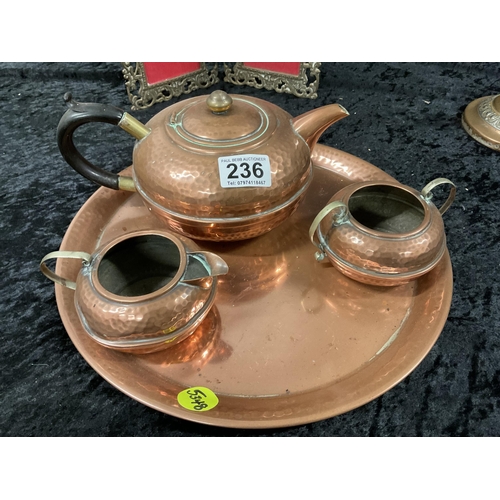 236 - COPPER 4 PIECE TEA SET,CANDLESTICKS A/F AND BRASS PHOTO FRAME