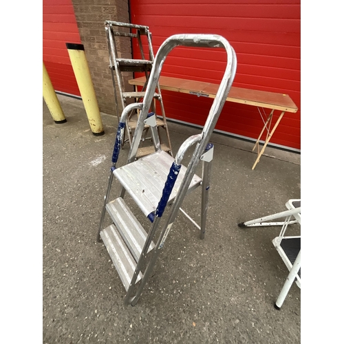 379 - 3 SETS OF STEP LADDERS AND PASTING TABLE