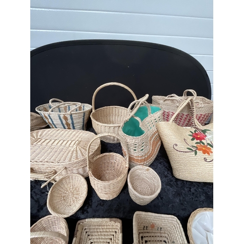 411 - CRATE OF BASKETS AND A LINEN BASKET