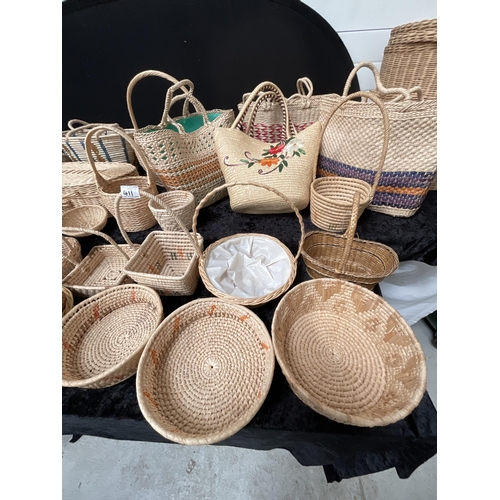 411 - CRATE OF BASKETS AND A LINEN BASKET