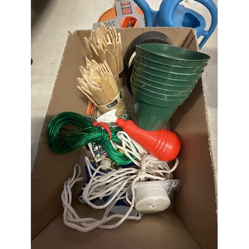 375 - 2 BOXES OF GARDEN ITEMS AND HOSE ON REEL