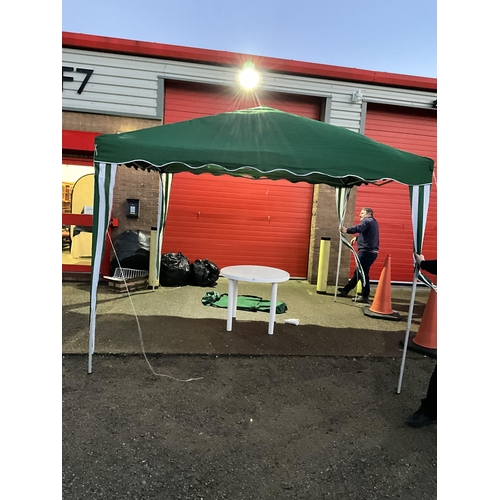 PLASTIC GARDEN TABLE ALONG WITH GREEN GAZEBO 10FT X 10FT