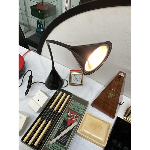 62 - BOX OF ODDS TO INCLUDE ANGLE POISE LAMP, MANTLE CLOCKS, CUTLERY AND METRONOME