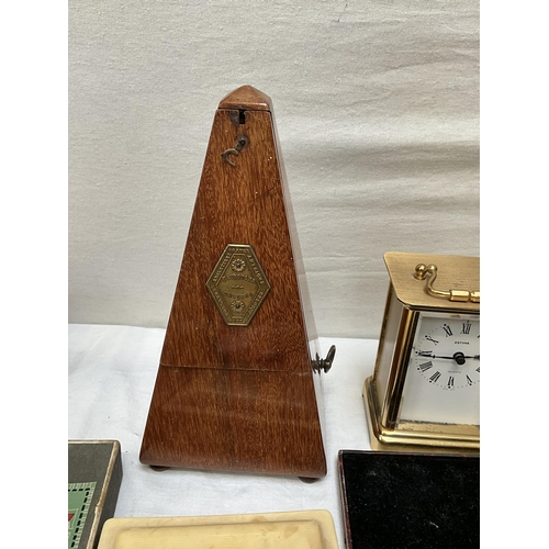 62 - BOX OF ODDS TO INCLUDE ANGLE POISE LAMP, MANTLE CLOCKS, CUTLERY AND METRONOME