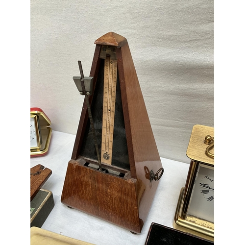 62 - BOX OF ODDS TO INCLUDE ANGLE POISE LAMP, MANTLE CLOCKS, CUTLERY AND METRONOME