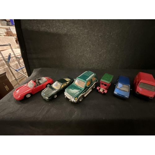 129 - CRATE OF TOY CARS AND A QTY OF COMICS