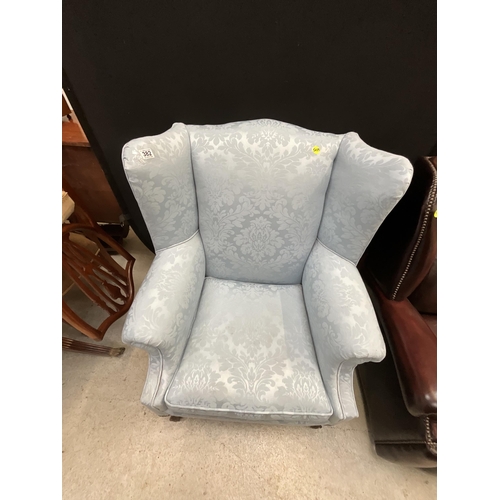 382 - BLUE UPHOLSTERED WING BACK ARMCHAIR ON CLAW AND BALL FEET