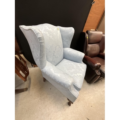 382 - BLUE UPHOLSTERED WING BACK ARMCHAIR ON CLAW AND BALL FEET