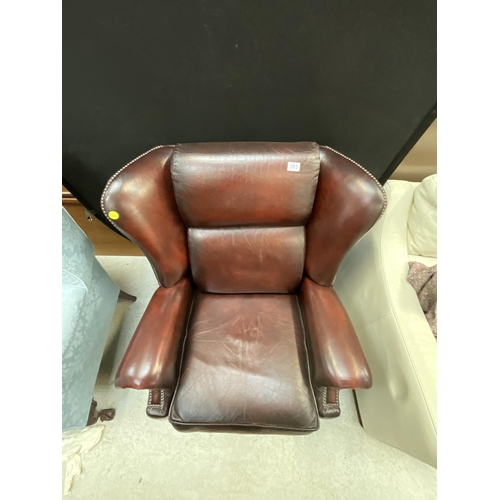 383 - OXBLOOD WING BACK LEATHER RECLINING CHAIR