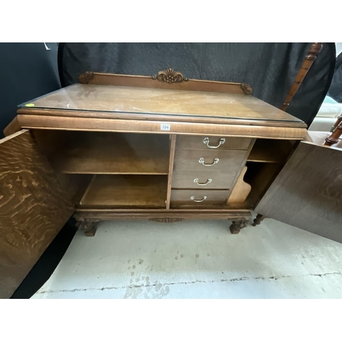 394 - ART DECO OAK SIDEBOARD WITH 2 DOORS CARVED DECORATION ON STRETCHERED BASE WITH FITTED INTERIOR H39