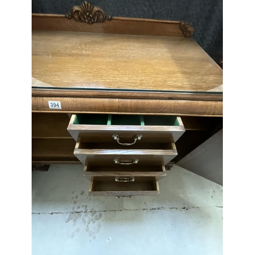 394 - ART DECO OAK SIDEBOARD WITH 2 DOORS CARVED DECORATION ON STRETCHERED BASE WITH FITTED INTERIOR H39