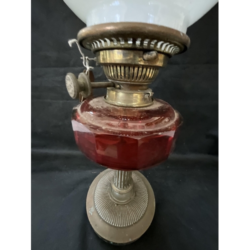 409 - VICTORIAN OIL LAMP WITH RED GLASS BOWL COMPLETE WITH SHADE AND FUNNEL H22