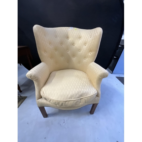 412 - YELLOW UPHOLSTERED BUTTON BACK MAHOGANY FIRESIDE CHAIR