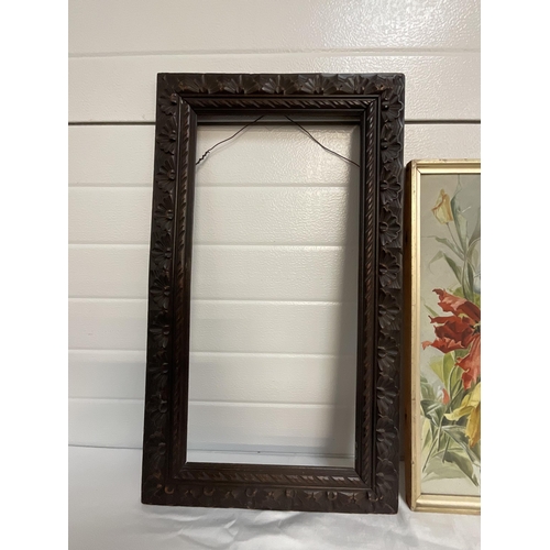 49 - 3 FRAMED FLORAL PRINTS AND A CARVED OAK FRAME 27