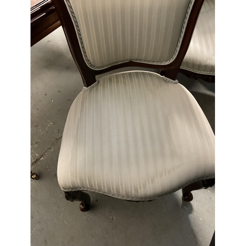 358 - REPRODUCTION MAHOGANY PULL OUT DINING TABLE WITH 1 LEAF ON REEDED LEGS AND BRASS CASTORS AND 6 MATCH... 