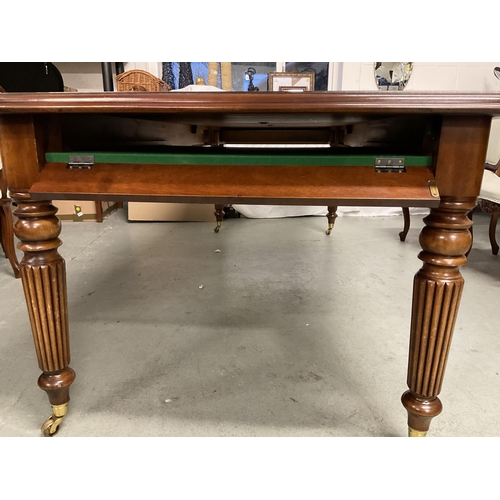 358 - REPRODUCTION MAHOGANY PULL OUT DINING TABLE WITH 1 LEAF ON REEDED LEGS AND BRASS CASTORS AND 6 MATCH... 