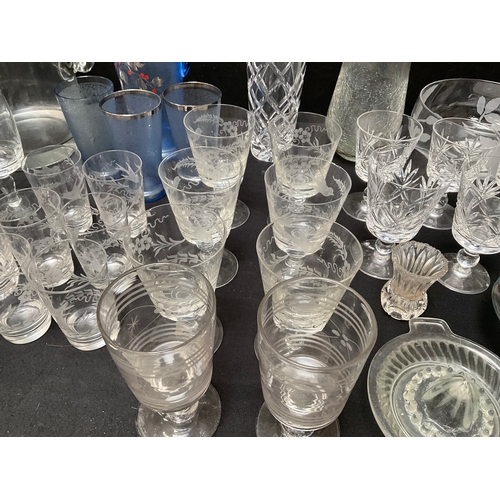 145 - 2 BOXES OF GLASSWARE TO INCLUDE CUT GLASS, DECANTERS, GLASS ICE BUCKET, VASES, COLOURED GLASS WATER ... 