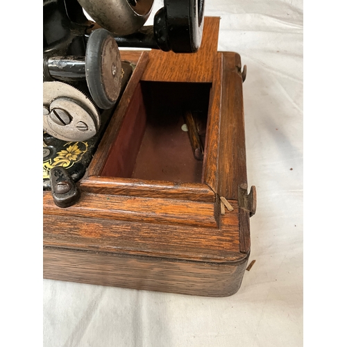 127 - VINTAGE OAK CASED SINGER SEWING MACHINE