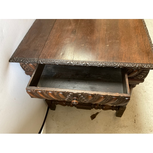 211 - VICTORIAN CARVED CENTRE TABLE WITH STRETCHERED CARVED BASE WITH DRAWER TO END A/F H30” L47” D30”