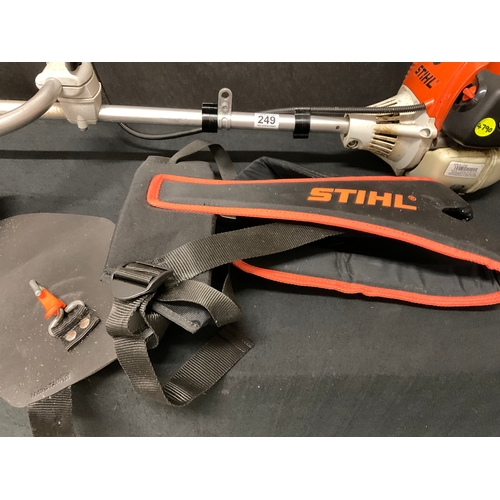 249 - STIHL FS 100 LONG REACH STRIMMER AND ACCESSORIES TO INCLUDE HARNESS, STRIM LINE, OIL, GEAR LUBRICANT... 