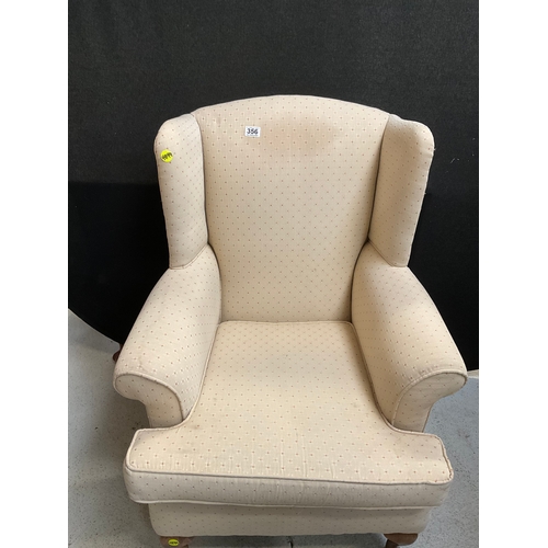 356 - UPHOLSTERED WINGBACK FIRESIDE ARMCHAIR ON CABRIOLE LEGS