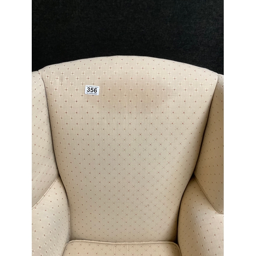 356 - UPHOLSTERED WINGBACK FIRESIDE ARMCHAIR ON CABRIOLE LEGS