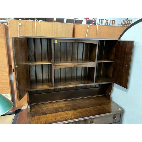 326 - REPRODUCTION DARK OAK DRESSER - TOP WITH OPEN CENTRAL SHELVES FLANKED BY 2 DOORS -BASE WITH 2 DRAWER... 