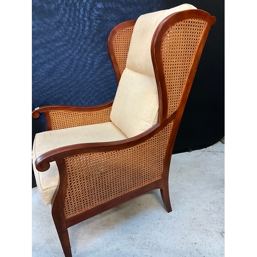 327 - MAHOGANY FRAMED BERGERE STYLE ARMCHAIR WITH FITTED CUSHIONS