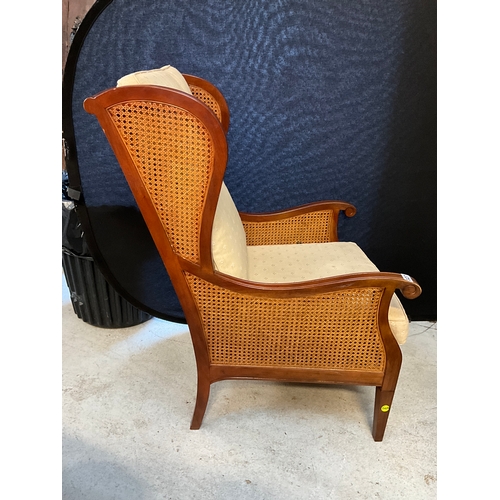 327 - MAHOGANY FRAMED BERGERE STYLE ARMCHAIR WITH FITTED CUSHIONS