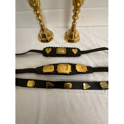 23 - PAIR OF BRASS CANDLE STICKS AND THREE MARTINGALES