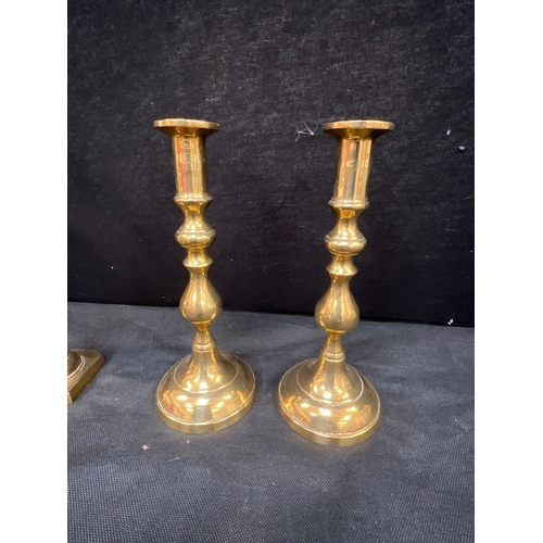 25 - THREE PAIRS OF BRASS CANDLE STICKS