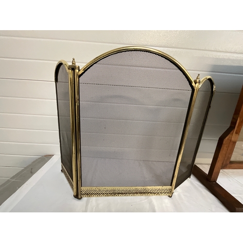 55 - TWO BRASS FIRE GUARDS AND A OAK FRAMED TAPESTRY EXAMPLE-  EXTENDING GUARD SIZE 33”x 23”