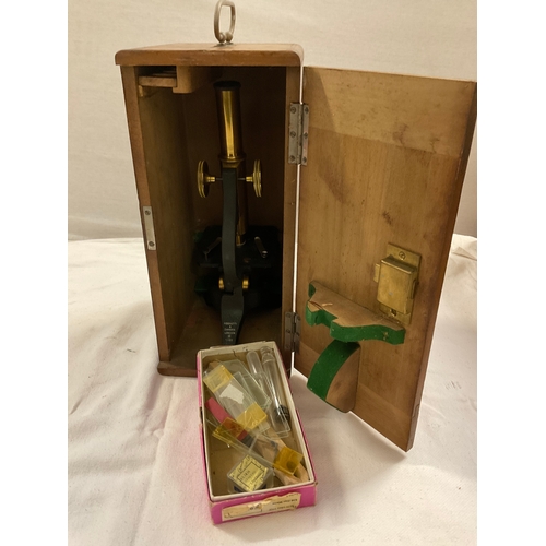 148 - NEGRETTI & ZAMBRA 353 MICROSCOPE AND SLIDES ETC IN ORIGINAL MAHOGANY CARRYING BOX WITH HANDLE AND KE... 