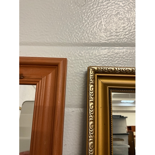 75 - TWO MODERN FRAMED WALL MIRRORS ONE GILT EFFECT AND A PINE ONE LARGEST 15”x39