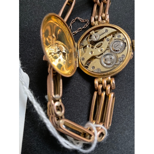 178 - VINTAGE LADIES 9ct GOLD CASED WATCH WITH STRAP AND SAFETY CHAIN TOTAL WEIGHT 20G - STRAP TESTS GOLD