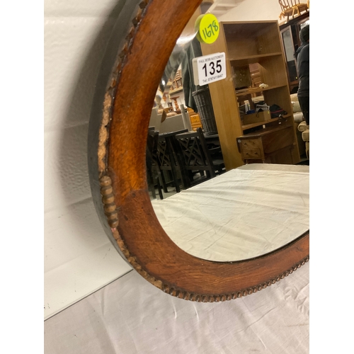 135 - VINTAGE OAK FRAMED OVAL WALL MIRROR A/F 
32” x 23”